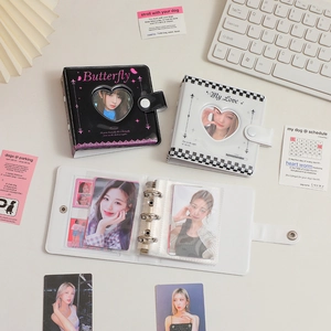 Detailed view of 3-hole loose-leaf mini photo album with heart cutout and snap closure