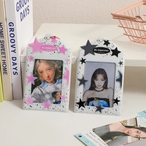 Close-up of pink and black star pattern photocard holders with 'My Superstar' text