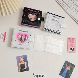 Detail view of 3-inch mini photo albums with heart cutout and butterfly checkerboard designs