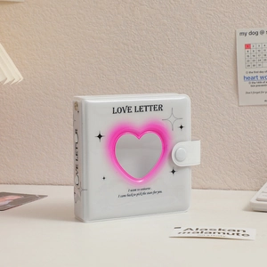 White Love Letter collect book featuring heart hollow window and snap button closure