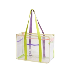 Macro shot of transparent PVC mesh beach bag with purple handles and cute cartoon print
