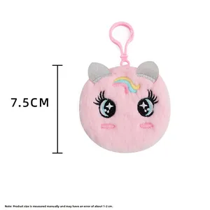 Close-up of 7.5cm pink plush unicorn keychain with embroidered eyes and silver ears