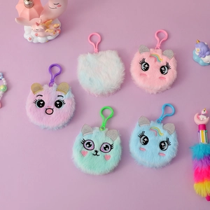 Detail of plush cat charms with large eyes and glitter ears in soft macaron pastel colors