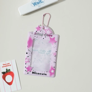 Detail of pink PVC photocard holder with star patterns and pink bead chain hanging accessory