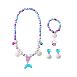 Detail of mermaid themed jewelry set with colorful beads and glittery tail pendant