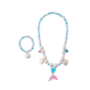 Detail of mermaid tail pendant jewelry set with gradient beads and shell charms
