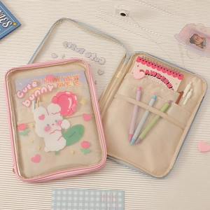 Detail of pink and blue PVC tablet sleeve with cute bunny print and mesh inner pockets