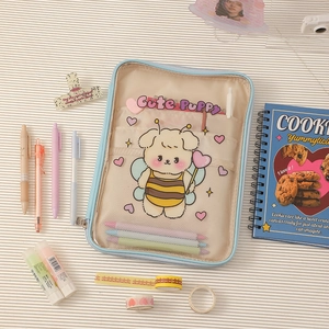 Detail view of cartoon bee puppy pencil case with transparent PVC window and inner mesh pocket