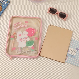 Detail of pink transparent iPad sleeve with mesh pocket for stationery and cables