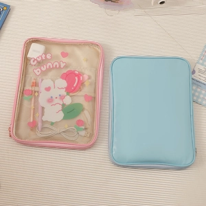 Detailed view of pink mesh and blue cartoon tablet bags for cables and accessories