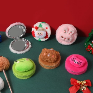 Close-up of adorable plush folding mirrors in various cute animal and holiday designs