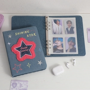 Detail of A5 denim binder featuring plush star embroidery and metal 6-ring binder structure