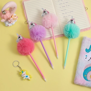 Unicorn stationery set with four colorful pom-pom ballpoint pens and matching keychain