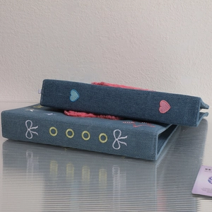 Y2K denim photo album with colorful embroidery and plush pink interior for kpop cards