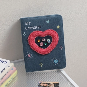 Detail of Y2K denim photo album with MY UNIVERSE embroidery and plush heart crystal window