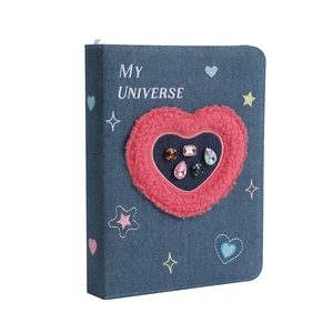 Close-up of A5 denim binder with plush heart, colorful gems and star embroidery