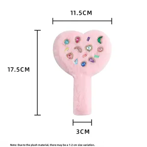 Detailed view of pink plush heart hand mirror with colorful gemstones and dimension markers