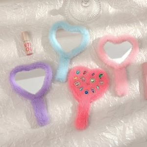 Cute heart-shaped fuzzy plush handheld makeup mirrors in four soft pastel colors