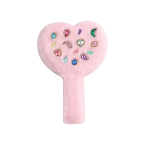 Detail of pink plush heart mirror with colorful inlaid rhinestones and soft handle