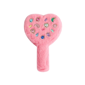 Detailed view of pink plush heart hand mirror decorated with colorful gemstones
