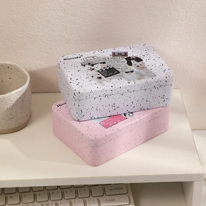 Detail of vintage metal tin organizers with retro illustrations and Hisocute brand logo