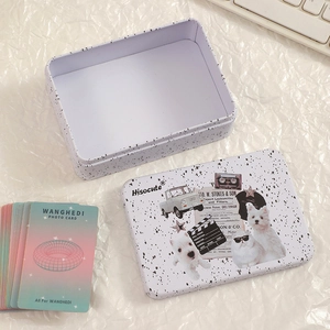 Detail of white polka dot tin box for photocard storage with vintage collage pattern