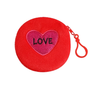 Detail of red plush coin purse with glitter heart patch and LOVE embroidery