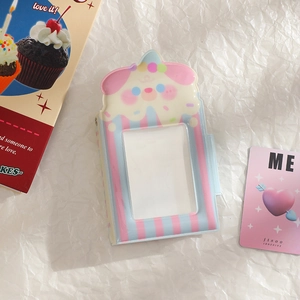 Detail view of dessert-themed photo album with transparent window for idol cards