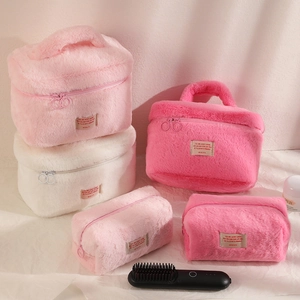 Large plush makeup bag set with top handle and soft faux fur texture in pastel colors