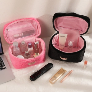 Detail of plush makeup bag featuring large capacity, mesh pocket, and interior elastic slots
