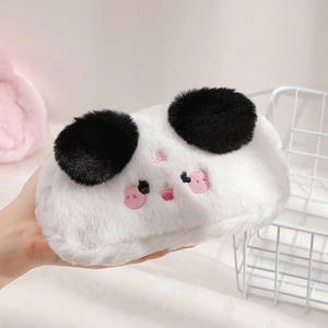 Close-up of a plush cartoon animal pencil case with soft white fur and pink embroidery