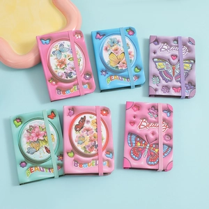 Set of six colorful mini butterfly notebooks with elastic bands for students and children