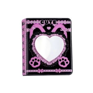 Close-up of three-inch photo album featuring heart window and cute cat paw design