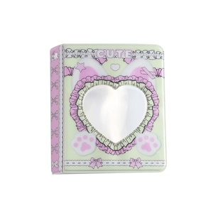 Macro detail of cute heart cutout photo album for polaroid cards with rabbit ear motifs