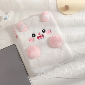 Detail of plush white monster tablet sleeve with pink ears and fuzzy texture