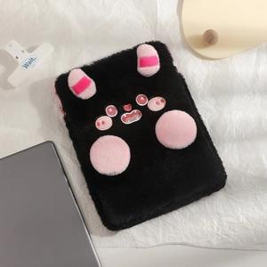 Detailed shot of cute monster plush iPad case with pink ears and soft faux fur texture