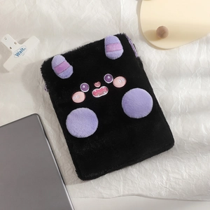 Detail of black plush tablet sleeve with cute cartoon devil embroidery and purple horns