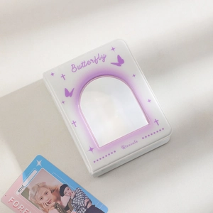 Detail of K-pop photocard album with purple butterfly design and hollow window