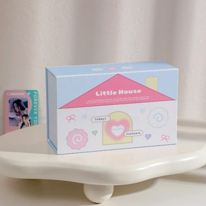 Close-up of the cute house-shaped magnetic storage box with pastel cartoon patterns