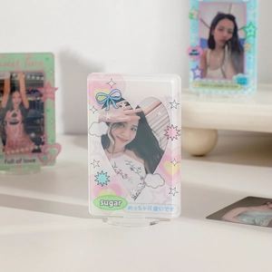 Detail showing acrylic star photo card stand with heart window and cloud decorations