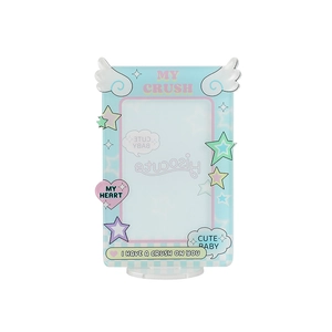 Detail of blue acrylic photo holder with angel wings and colorful star patterns