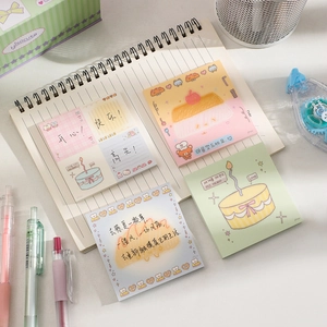 Set of four cute cartoon dessert themed square note pads on a spiral notebook background