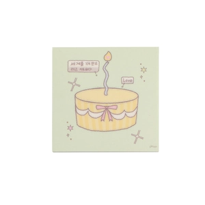 Detailed close-up of square notepad with cute cartoon cake illustration and pastel green tones