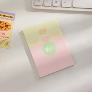 Detailed view of cute bear sticky notes featuring a pink-yellow gradient and hashtag design