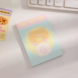 Close-up of cute cartoon bear sticky notes on desk with mechanical keyboard background