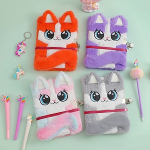 Detail of plush cat notebook covers with metal locks and cute embroidered eyes