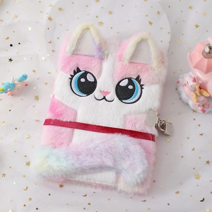 Close-up of fluffy cat diary with embroidered blue eyes and silver metal padlock
