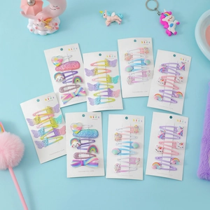 Dettaglio del set di 6 fermagli per capelli unicorno con fiocchi glitterati per bambine
