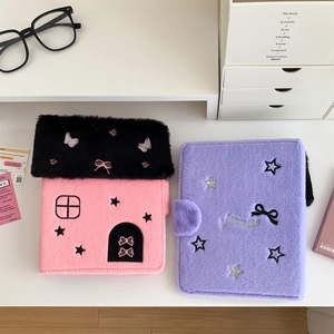 Detail of plush photocard binders featuring house shapes and cute star embroidery