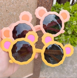 Cute bear-shaped children's sunglasses in light pink and bright yellow colors